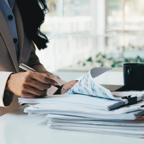 Accounting planning budget concept : Business woman offices working for arranging documents